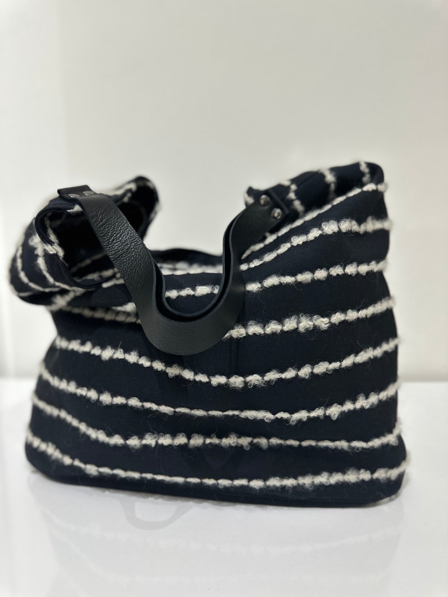 Dettaglio del manico della borsa Sacca