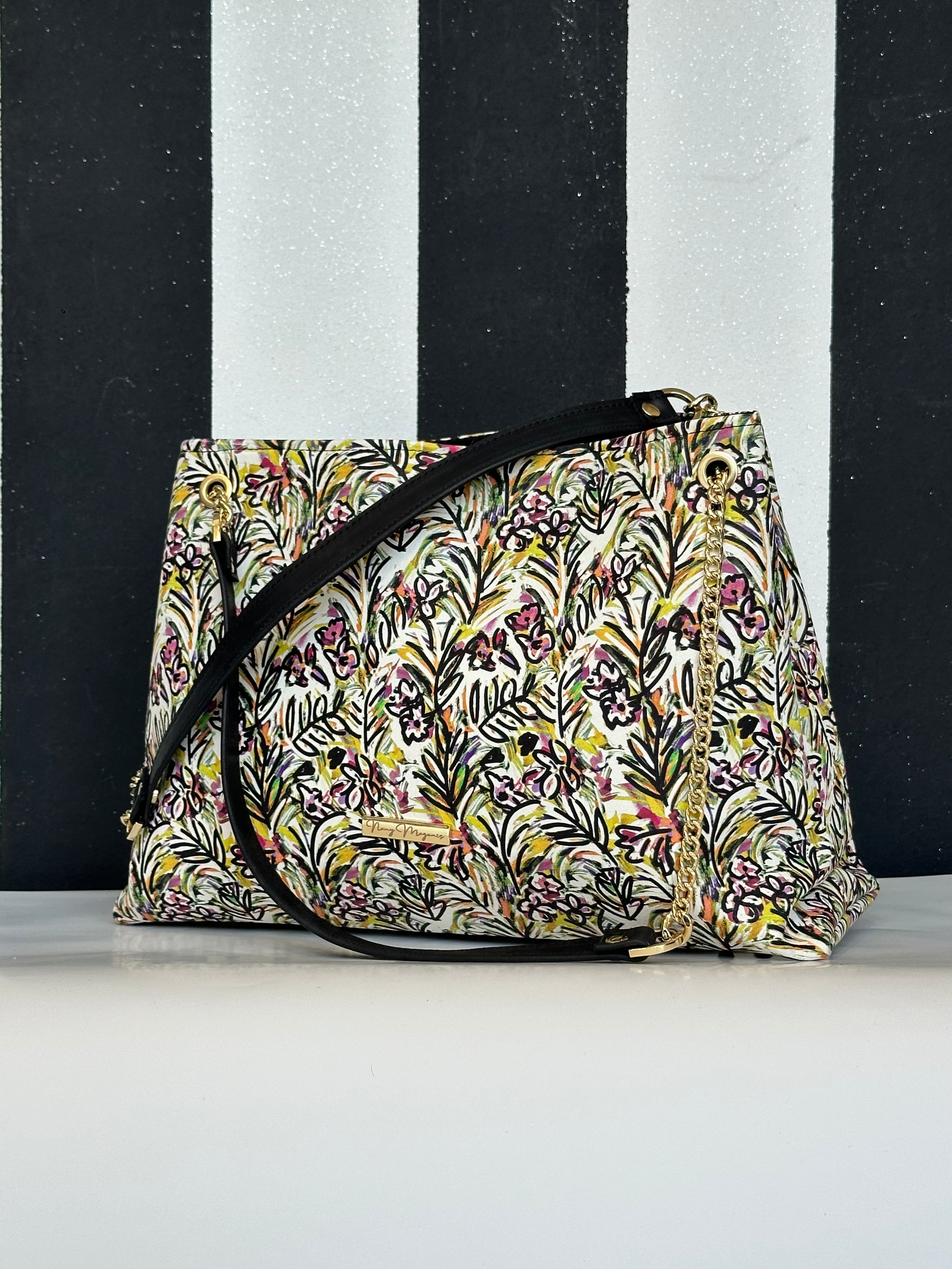 Borsa artigianale a spalla e tracolla in vera pelle con fantasia floreale. Modello Ismi di Nany Magenis