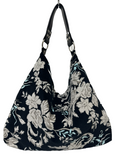Borsa artigianale a spalla in tessuto con fantasia floreale. Modello Sacca di Nany Magenis